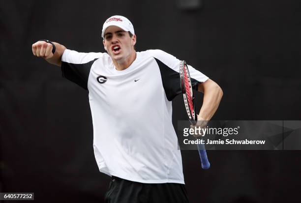John Isner of the University of Georgia celebrates a point against Kevin Anderson of the University of Illinois during the Division I Men's Tennis...