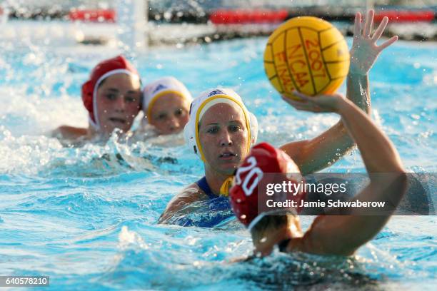 Kelly Rulon of UCLA pressures Lauren Silver of Stanford University during the Division I Women's Water Polo Championship held at the Joint Forces...