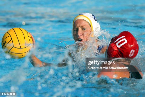 Kelly Rulon of UCLA looks for an open teammate against Katie Hansen of Stanford University during the Division I Women's Water Polo Championship held...