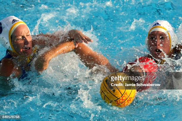 Kelly Rulon and Jillian Kraus of UCLA battle Alison Gregorka of Stanford University for the ball during the Division I Women's Water Polo...