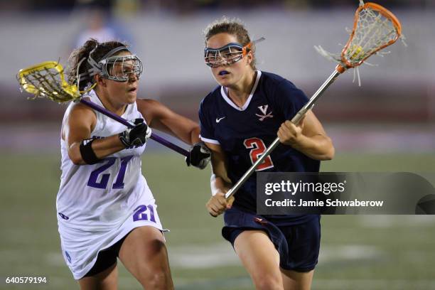 Lindsay Finocchiaro of Northwestern University pressures Blair Weymouth of the University of Virginia during the Division I Women's Lacrosse...