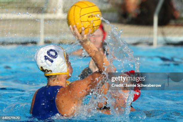 Lauren Silver of Stanford University pressures Kelly Rulon of UCLA during the Division I Women's Water Polo Championship held at the Joint Forces...