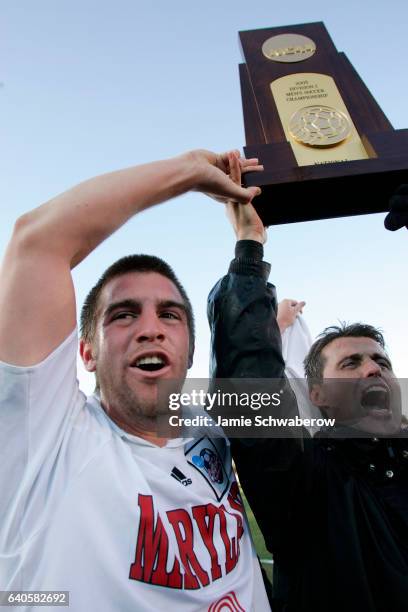 Jason Garey and Coach Sasho Cirovski of the University of Maryland celebrate their victory over the University of New Mexico during the Division I...