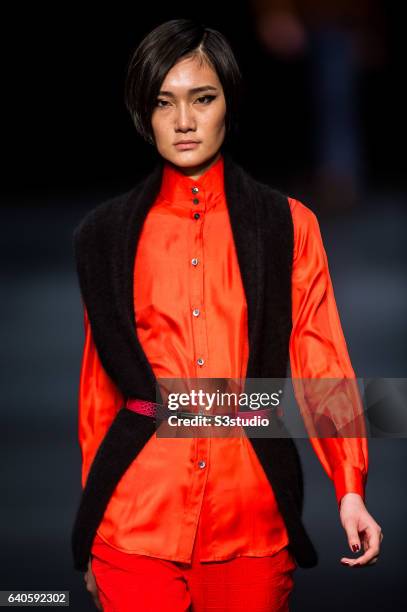 Model showcases designs by Shanghai Tang during the Day 4 of the Hong Kong Fashion Week for Fall / Winter 2015 at the Hong Kong Convention and...