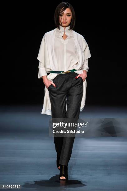 Model showcases designs by Shanghai Tang during the Day 4 of the Hong Kong Fashion Week for Fall / Winter 2015 at the Hong Kong Convention and...