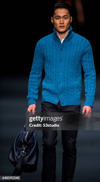 Model showcases designs by Shanghai Tang during the Day 4 of the Hong Kong Fashion Week for Fall / Winter 2015 at the Hong Kong Convention and...