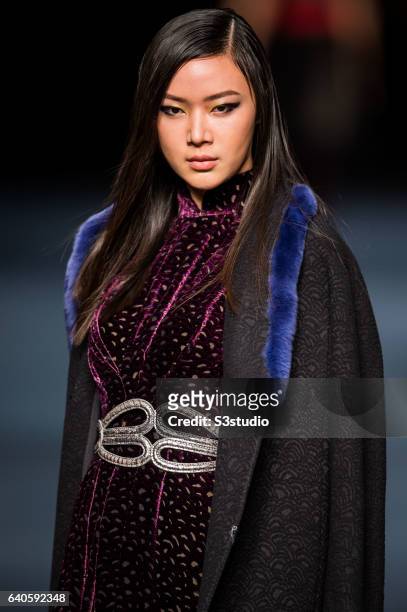 Model showcases designs by Shanghai Tang during the Day 4 of the Hong Kong Fashion Week for Fall / Winter 2015 at the Hong Kong Convention and...