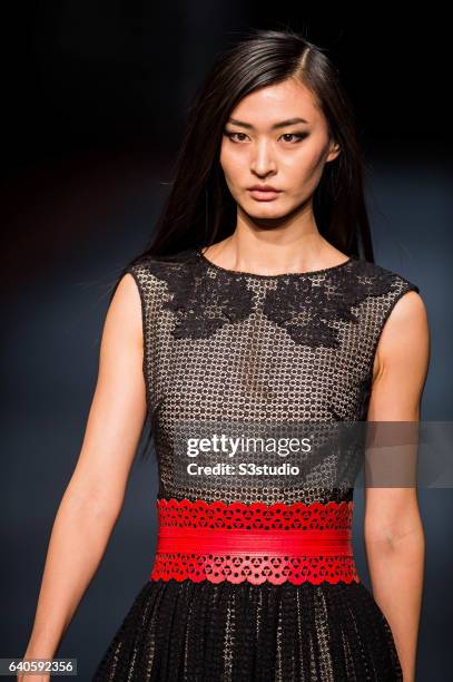 Model showcases designs by Shanghai Tang during the Day 4 of the Hong Kong Fashion Week for Fall / Winter 2015 at the Hong Kong Convention and...