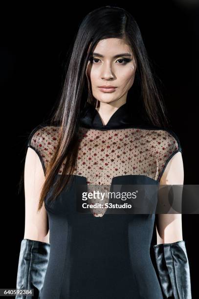 Model showcases designs by Shanghai Tang during the Day 4 of the Hong Kong Fashion Week for Fall / Winter 2015 at the Hong Kong Convention and...