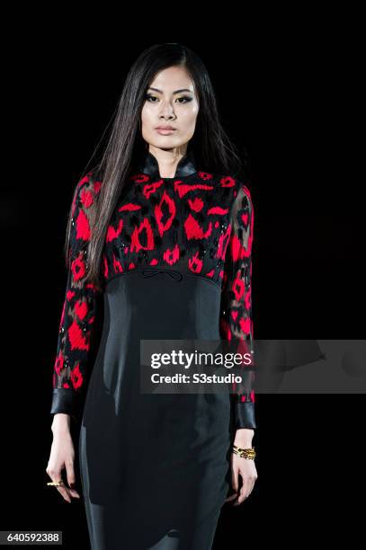 Model showcases designs by Shanghai Tang during the Day 4 of the Hong Kong Fashion Week for Fall / Winter 2015 at the Hong Kong Convention and...