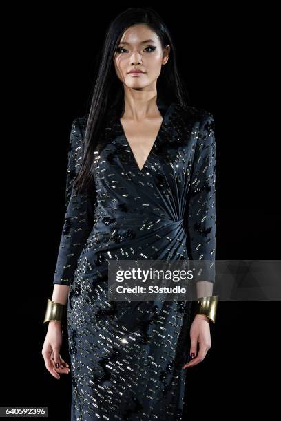 Model showcases designs by Shanghai Tang during the Day 4 of the Hong Kong Fashion Week for Fall / Winter 2015 at the Hong Kong Convention and...