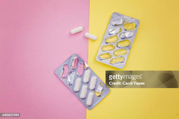 medicine blister in pastel background - blister pack stock pictures, royalty-free photos & images