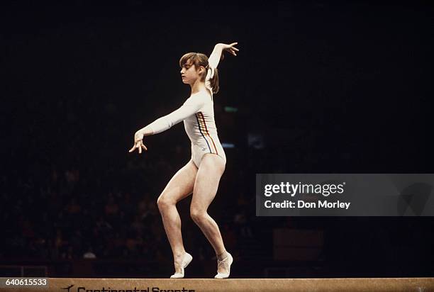 Nadia Comaneci of Romania performs her routine on the Balance Beam during the Women's ArtisticTeam all-around event on 19 July 1976 during the XXI...