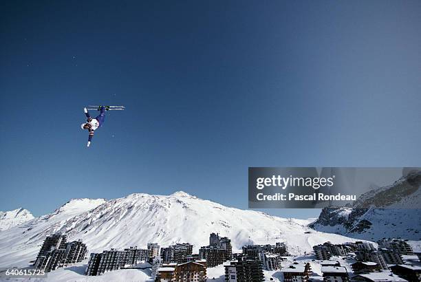 Freestyle skiing competitor performs an aerial routine during the Freestyle ski event on 13 February 1992 at the XVI Olympic Winter Games in Tignes,...