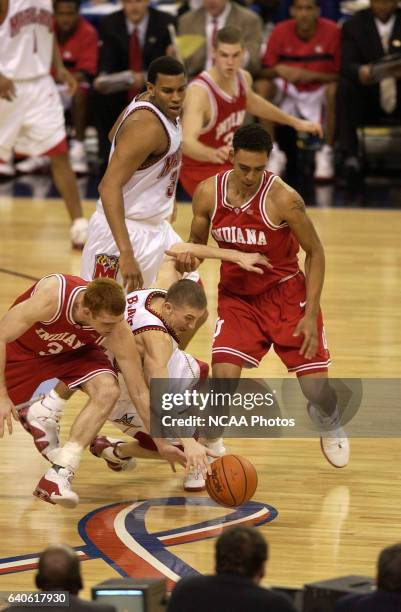 Tom Coverdale and Jared Jeffries of Indiana battle for control of a loose ball with Steve Blake of Maryland during the NCAA Photos via Getty Images...