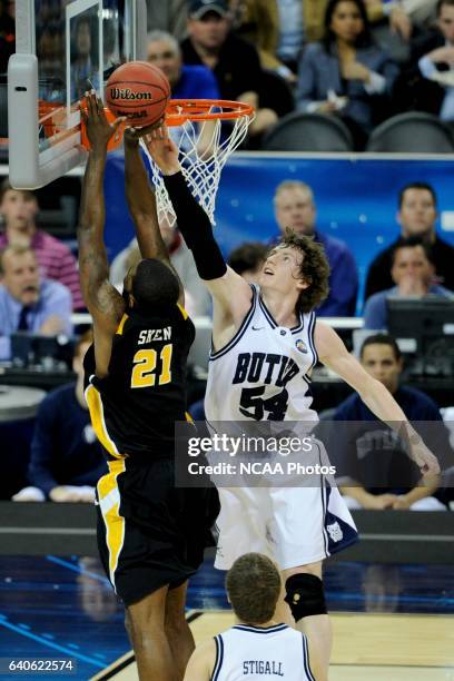 Matt Howard of Butler University tries to block a shot by Jamie Skeen of Virginia Commonwealth University during the semifinal game of the 2011 NCAA...