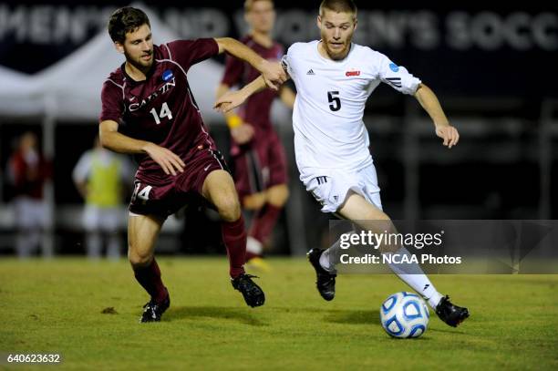 Jacob Eganhouse of Ohio Wesleyan University battles Dino Duratovic of Calvin College during the Division III Men's Soccer Championship held at...