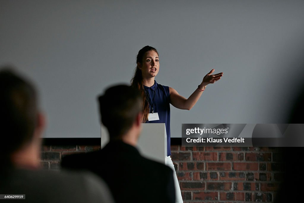 Businesswoman doing presentation at convention