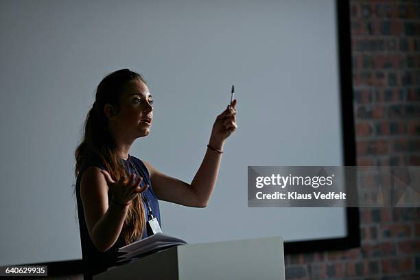 businesswoman doing a talk at convetion - auditorium presentation stock pictures, royalty-free photos & images