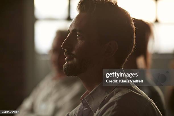 profile portrait of businessman at convention - soft focus stock pictures, royalty-free photos & images