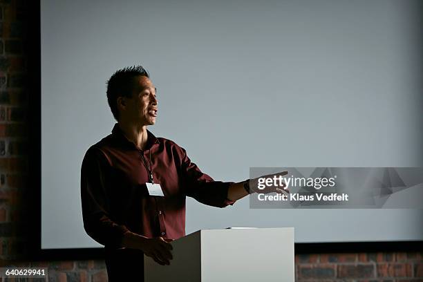 businessman doing at lecture in auditorium - 演説 ストックフォトと画像