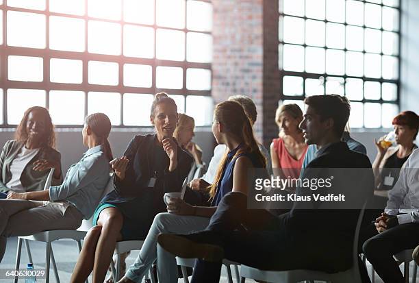 group of businesspeople at lecture in auditorium - auditoria bildbanksfoton och bilder