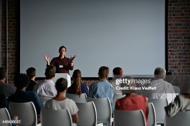 businessman doing a presentation at big convention - projection screen ストックフォトと画像