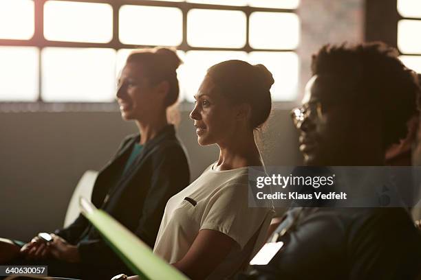 group of businesspeople at lecture in auditorium - soft focus stock pictures, royalty-free photos & images