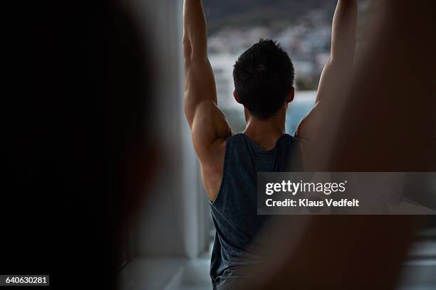 close-up of people streching at yoga class - zen man stock pictures, royalty-free photos & images