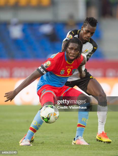 Of DR Congo and JOHN BOYE of Ghana during the quarter final match between Ghana and DR Congo at Stade Oyem on January 29, 2017 in Oyem, Gabon.