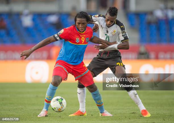 Of DR Congo and JOHN BOYE of Ghana during the quarter final match between Ghana and DR Congo at Stade Oyem on January 29, 2017 in Oyem, Gabon.