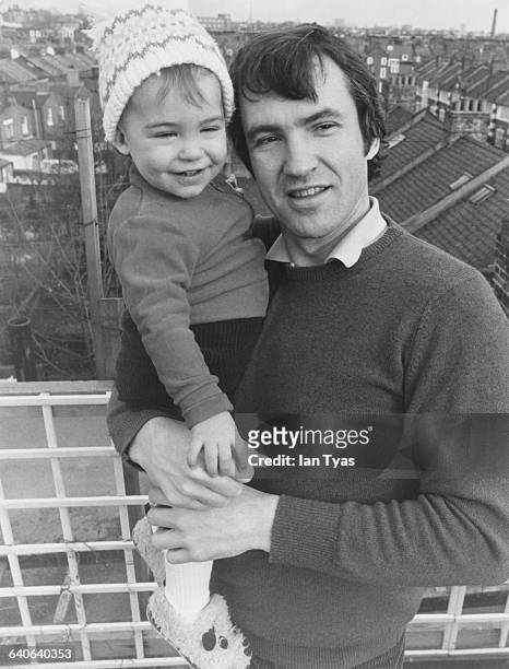 English actor and radio presenter Larry Lamb at his home in Fulham, London with his son George, 18th March 1981. George later followed his father...