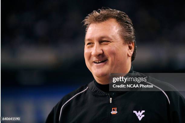 West Virginia head coach Bob Huggins shares a smile with the referee during the semi final game between Duke and West Virginia at the Men's Final...