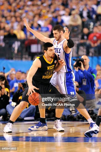 Deniz Kilicli of West Virginia posts up in front of Brian Zoubek of Duke during the semi final game between Duke and West Virginia at the Men's Final...