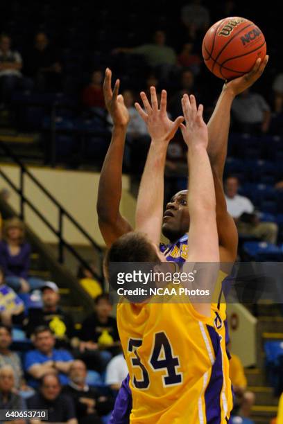 Center Troy Whittington of Williams College drives to the hoop against Forward Louis Hurd of Wisconsin-Stevens Point during the Division III Men's...