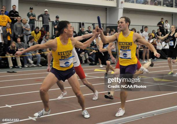 Josh Schwinn hands off the baton to David Litsheim of Wisconsin Stevens Point during the men's 4 x 400 meter relay during the Division III Men's and...