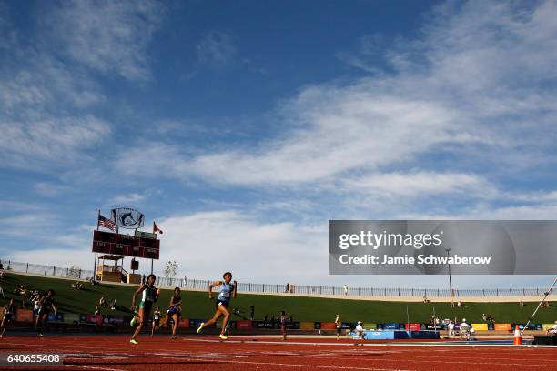 Quanera Hayes of Livingstone and Kayon Robinson race to a first and second place finish in the 400 meter dash during the Division II Men's and...