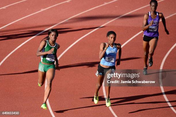 Quanera Hayes of Livingstone and Kayon Robinson race to a first and second place finish in the 400 meter dash during the Division II Men's and...