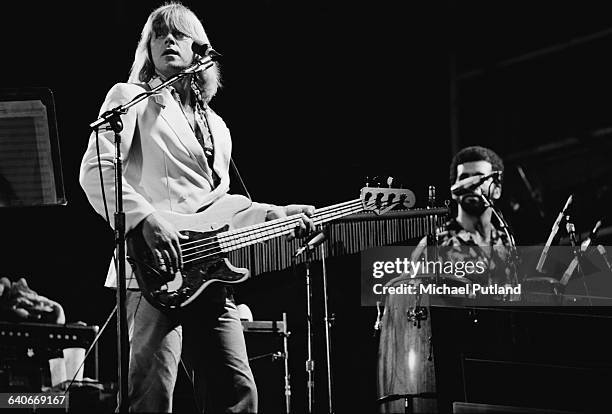 Singer and bassist Peter Cetera performing with American rock group, Chicago, USA, September 1978. On the right is percussionist Laudir de Oliveira.