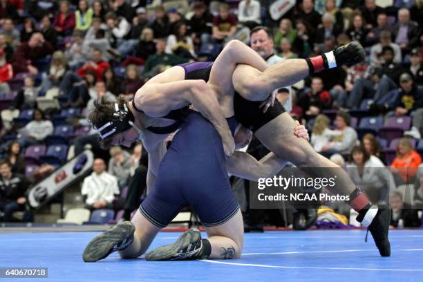 Mike Benefiel of Elmhurst wrestles against Alex Coolidge of Cornell College of Iowa in their 197 lb. Class match during the NCAA Photos via Getty...