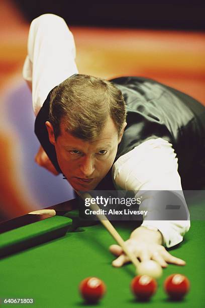 Steve Davis of Great Britain lines up the cue ball during his World Snooker Championship first round match against Simon Bedford on 19 April 1998 at...