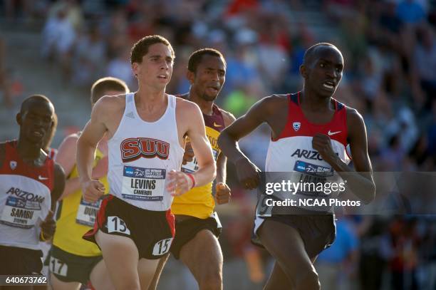 Cameron Levins of Southern Utah University and Lawi Lalang of Arizona battle for first in the men's 5000 meter race during the Division I Men's and...