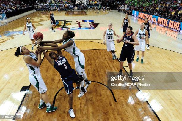 Devereaux Peters of the University of Notre Dame delivers a hard foul against Tiffany Hayes of the University of Connecticut during the Division I...