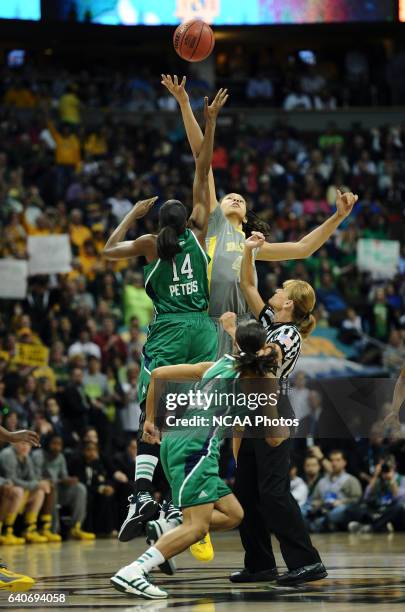 Devereaux Peters of the University of Notre Dame and Brittney Griner of Baylor University jump the opening tip off to start the game during the...