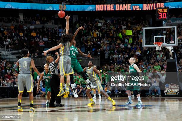 Brittney Griner of Baylor University tips off against Devereaux Peters of the University of Notre Dame during the Division I Women's Basketball...