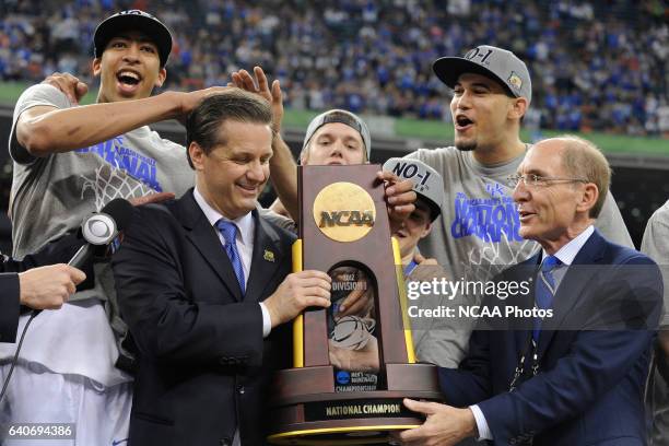 Head Coach John Calipari, Anthony Davis and the rest of players from the University of Kentucky celebrate with the championship trophy following the...