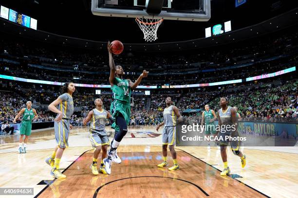 Devereaux Peters of the University of Notre Dame drives to the basket against Baylor University during the Division I Women's Basketball Championship...