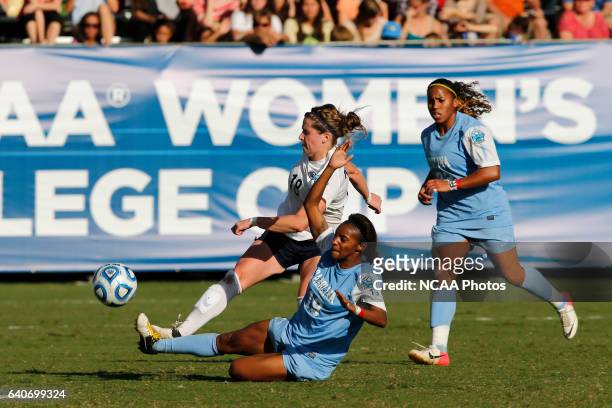 Crystal Dunn of the University of North Carolina slides in to steal the ball from Maddy Evans of Penn State University during the Division I Women's...