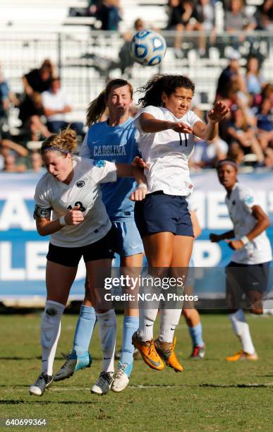 Kelly McFarlane of the University of North Carolina and Raquel Rodriguez and Maddy Evans of Penn State University jump for the ball during the...