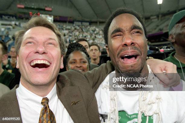 Michigan St. Head coach Tom Izzo and tournament MVP Mateen Cleaves are overcome with emotions after cliniching the title during the Division I Men's...